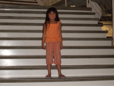 Kasen posing on the stairs at the Discovery Center